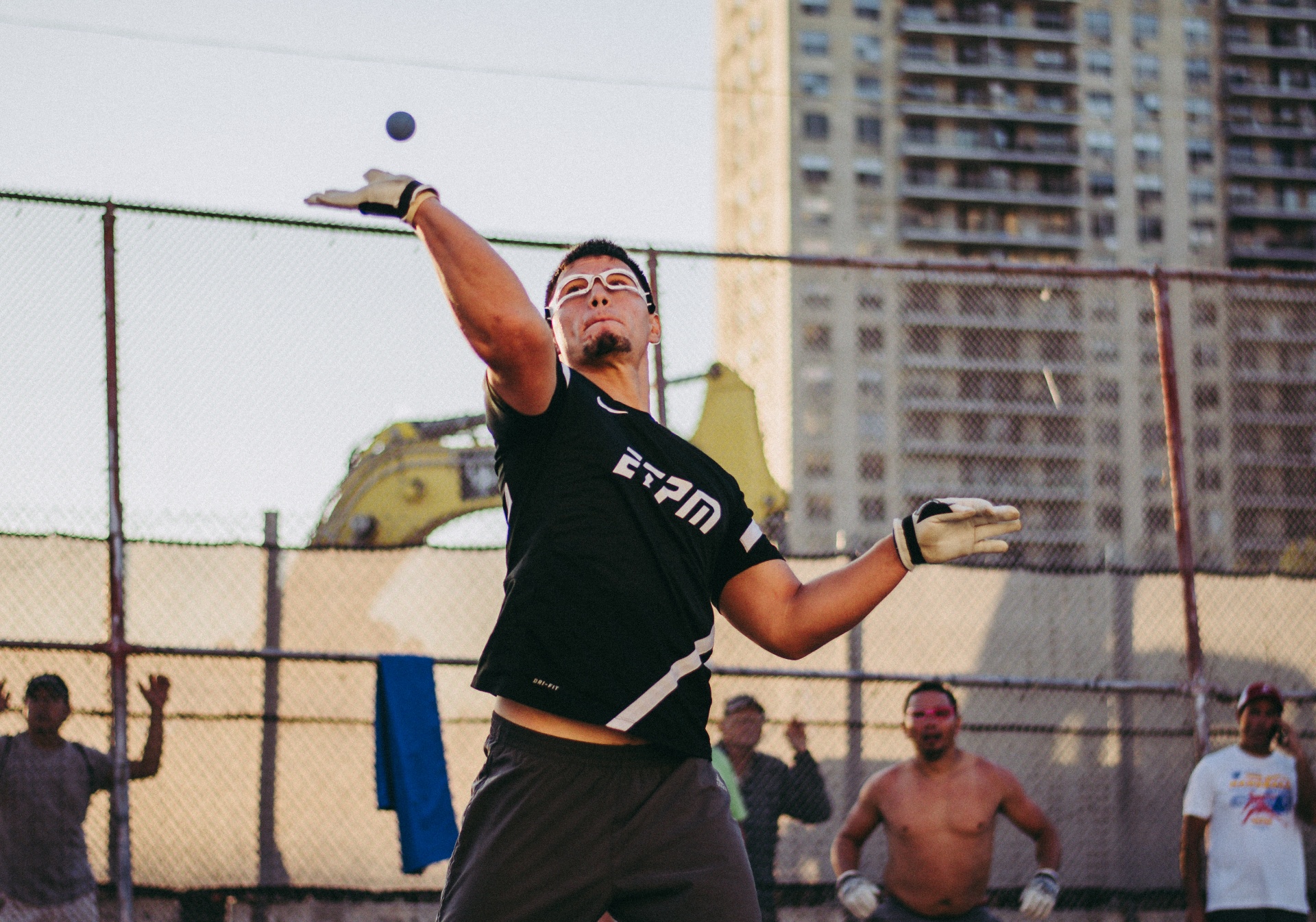 Handball player serving on a restored neighborhood court
