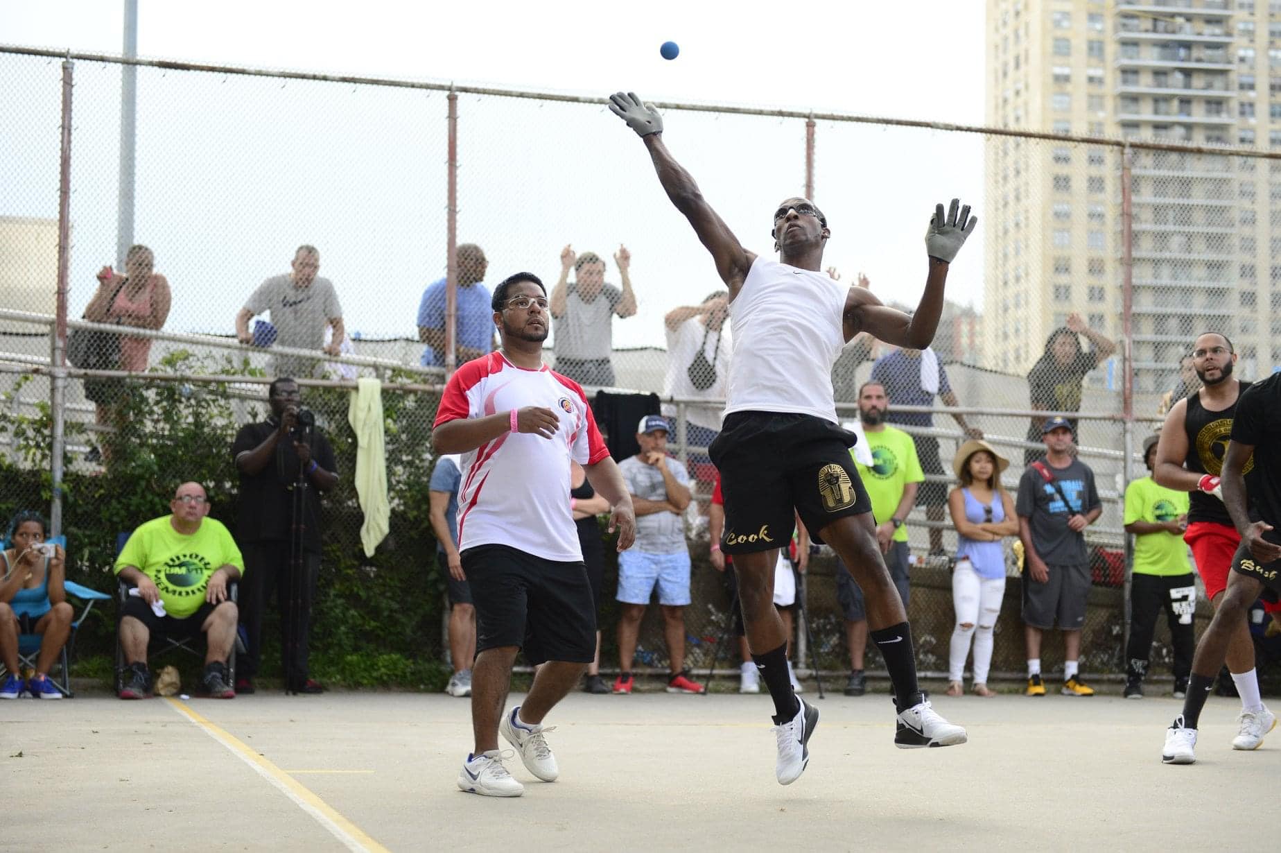 Player leaping for a spike at a Big Blue Handball festival